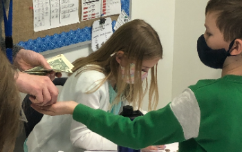 student counting money