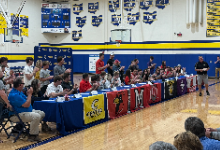 students and families at athletics signing day