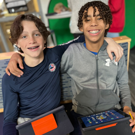 two students smiling