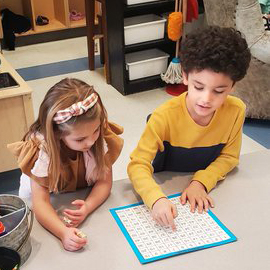 two students working together in class