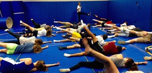 Students and teacher stretching